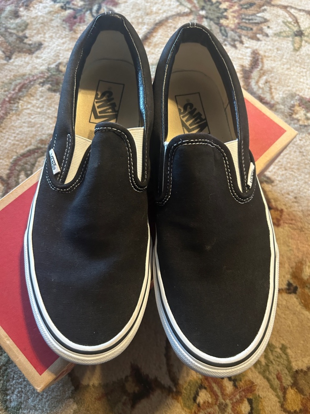 Like new in box. Vans Black & White Classic Slip-On Canvas Mens 9 women 10.5